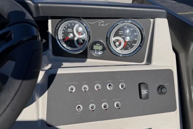 Slide: The Image of Dashboard of 2026 Alera A22Q boat with gauges and control switches. - 22