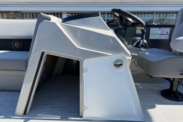 Slide: The Image of 2026 Alera A22Q boat console with steering wheel and seating area. - 26