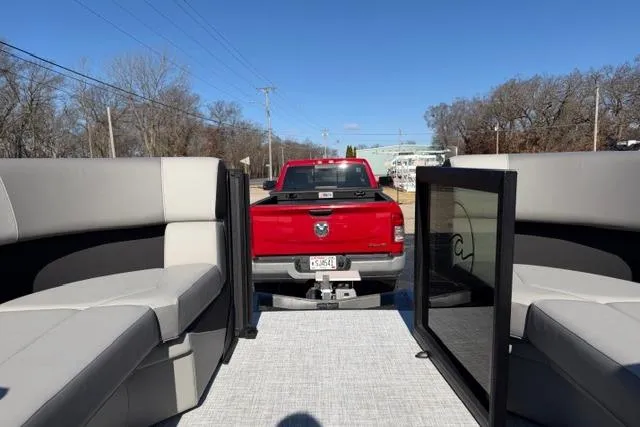 Slide: The Image of Red truck towing Alera A22Q pontoon boat, 2026 model, on a sunny day. - 29