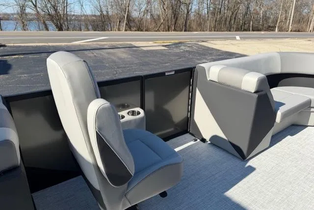 Slide: The Image of Interior of 2026 Alera A22Q boat with gray seating and cup holders. - 32