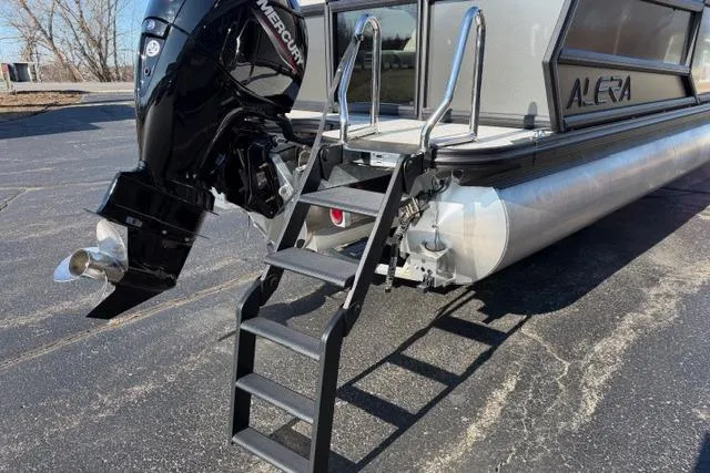 Slide: The Image of 2026 Alera A22Q pontoon boat with Mercury outboard motor and boarding ladder. - 8