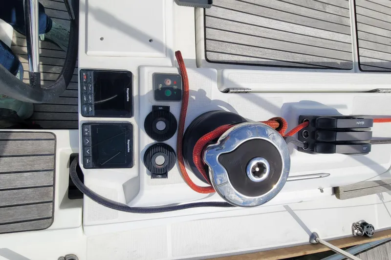 Slide: The Image of Cockpit controls of 2017 Jeanneau Sun Odyssey 44 DS sailboat with winch and navigation instruments. - 11
