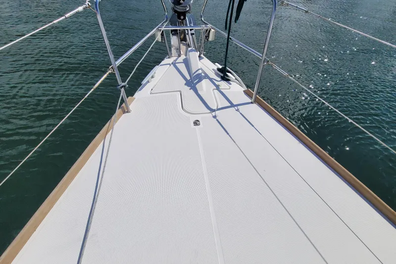 Slide: The Image of Deck view of 2017 Jeanneau Sun Odyssey 44 DS sailboat on calm water. - 12
