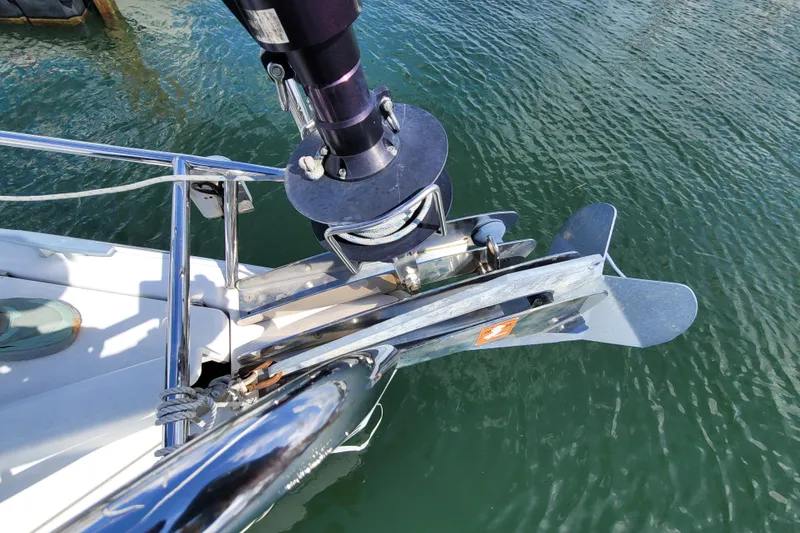 Slide: The Image of Bow of 2017 Jeanneau Sun Odyssey 44 DS sailboat with anchor and clear water. - 13