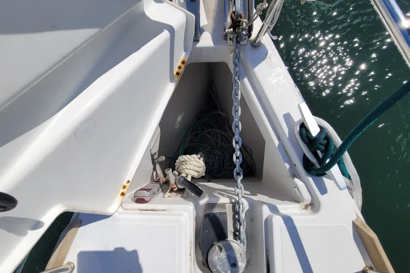 Slide: The Image of Anchor locker of 2017 Jeanneau Sun Odyssey 44 DS with chain and ropes. - 14