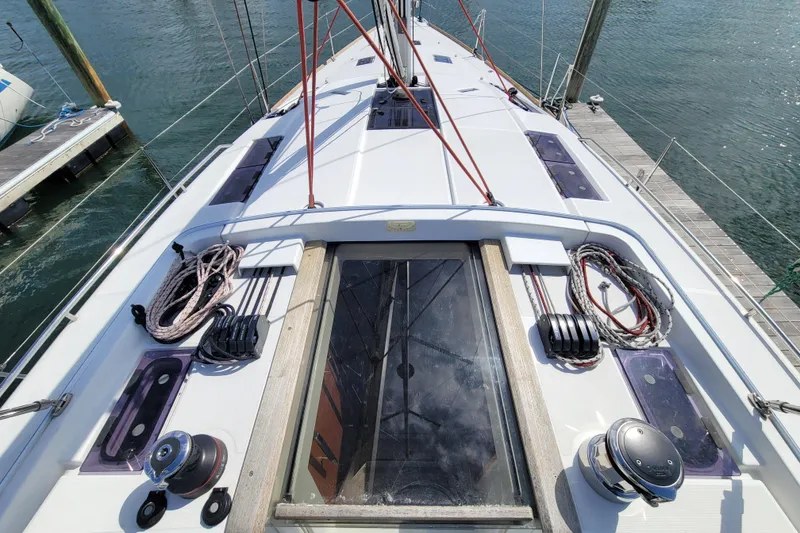 Slide: The Image of Deck view of 2017 Jeanneau Sun Odyssey 44 DS sailboat at marina. - 18