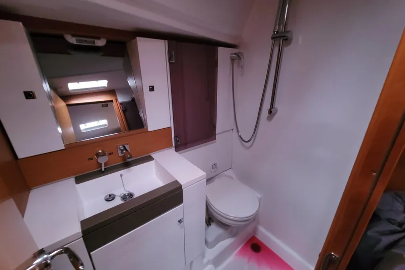 Slide: The Image of Modern bathroom in 2017 Jeanneau Sun Odyssey 44 DS yacht, featuring shower and sink. - 29