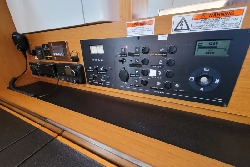 Slide: The Image of Control panel of a 2017 Jeanneau Sun Odyssey 44 DS sailboat, featuring navigation and electrical systems. - 33