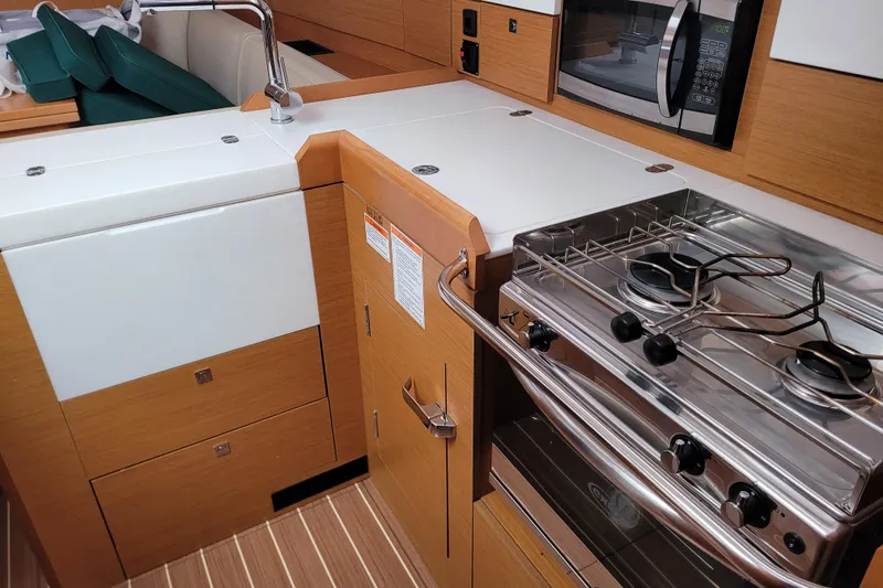 Slide: The Image of Modern kitchen in 2017 Jeanneau Sun Odyssey 44 DS yacht with stove and microwave. - 34