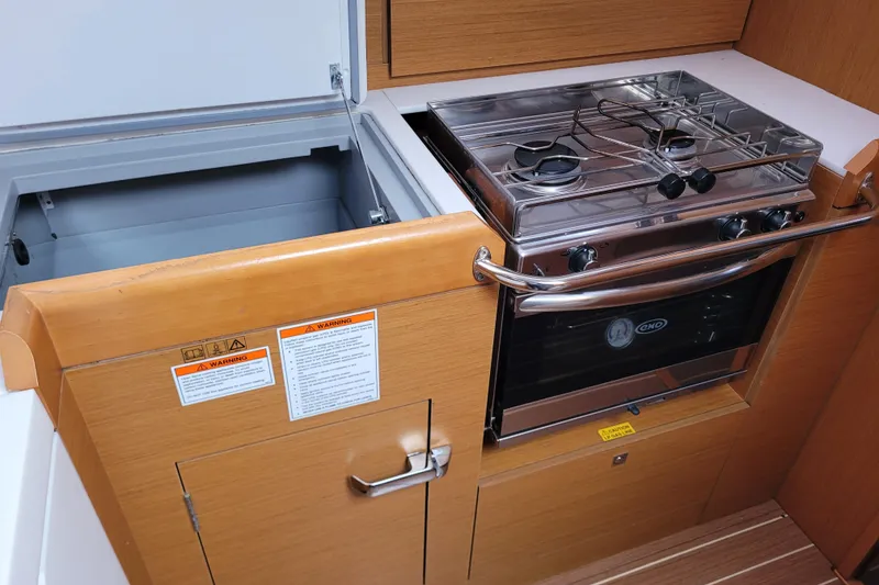 Slide: The Image of Galley kitchen in 2017 Jeanneau Sun Odyssey 44 DS with stove and storage. - 36