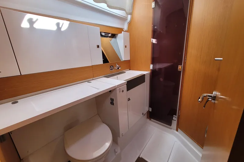 Slide: The Image of Bathroom interior of 2017 Jeanneau Sun Odyssey 44 DS yacht, featuring modern fixtures and wood accents. - 39