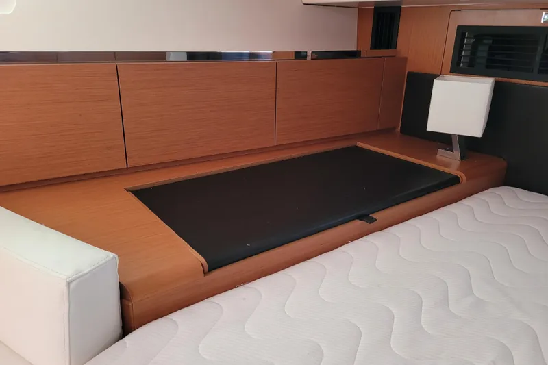 Slide: The Image of Interior of 2017 Jeanneau Sun Odyssey 44 DS yacht with modern wood cabinetry and sleek design. - 45