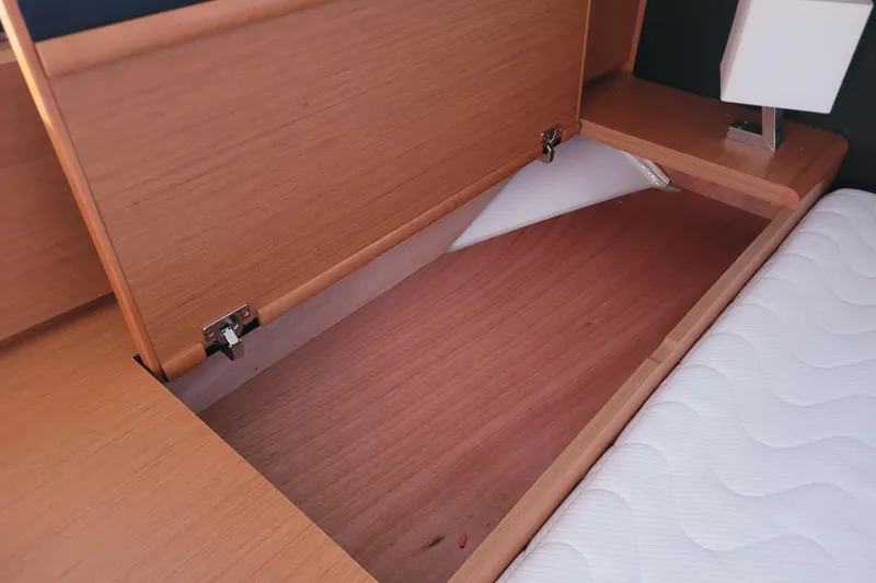 Slide: The Image of Under-bed storage compartment in 2017 Jeanneau Sun Odyssey 44 DS yacht cabin. - 46