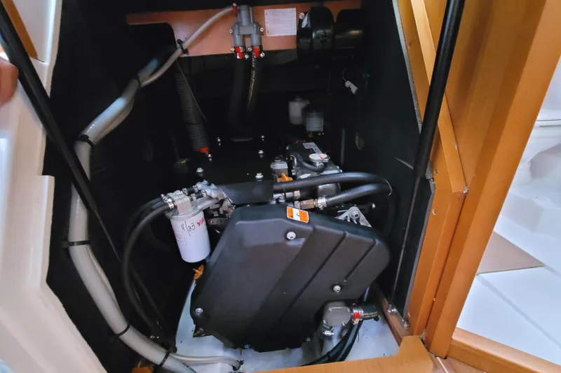 Slide: The Image of Engine compartment of 2017 Jeanneau Sun Odyssey 44 DS sailboat, showcasing mechanical components. - 48