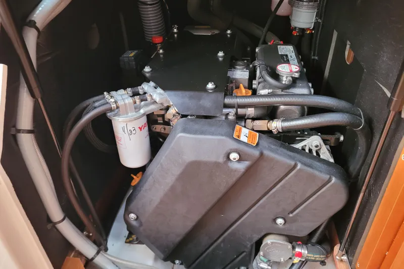 Slide: The Image of Engine compartment of 2017 Jeanneau Sun Odyssey 44 DS sailboat, showcasing mechanical components. - 52