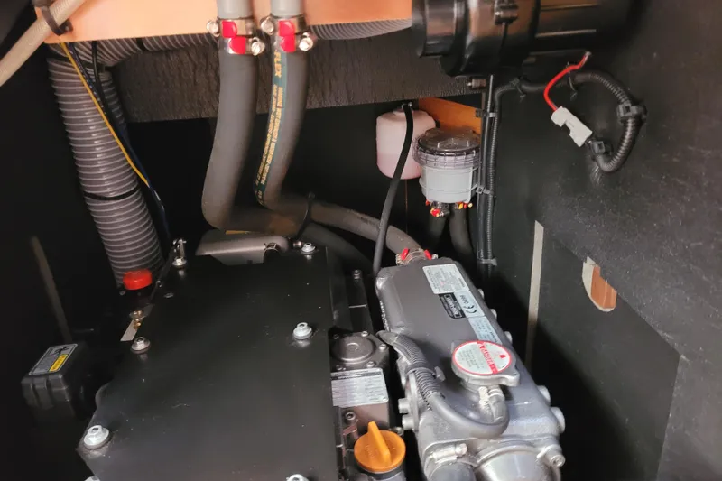 Slide: The Image of Engine compartment of 2017 Jeanneau Sun Odyssey 44 DS sailboat, showcasing mechanical components. - 53