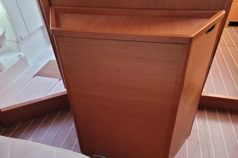 Slide: The Image of Interior of 2017 Jeanneau Sun Odyssey 44 DS yacht, featuring wooden cabinetry and flooring. - 54