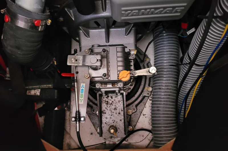 Slide: The Image of Engine compartment of a 2017 Jeanneau Sun Odyssey 44 DS sailboat, featuring Yanmar components. - 56