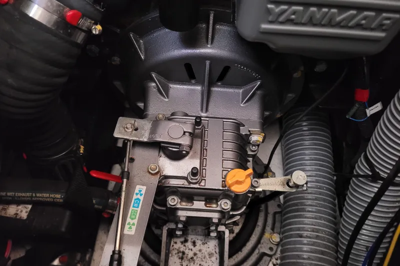 Slide: The Image of Engine compartment of a 2017 Jeanneau Sun Odyssey 44 DS sailboat, featuring Yanmar components. - 57