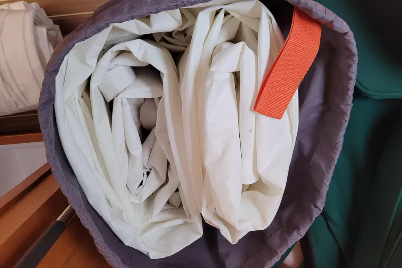 Slide: The Image of Rolled sail stored in a bag with an orange strap, Jeanneau Sun Odyssey 44 DS, 2017. - 73