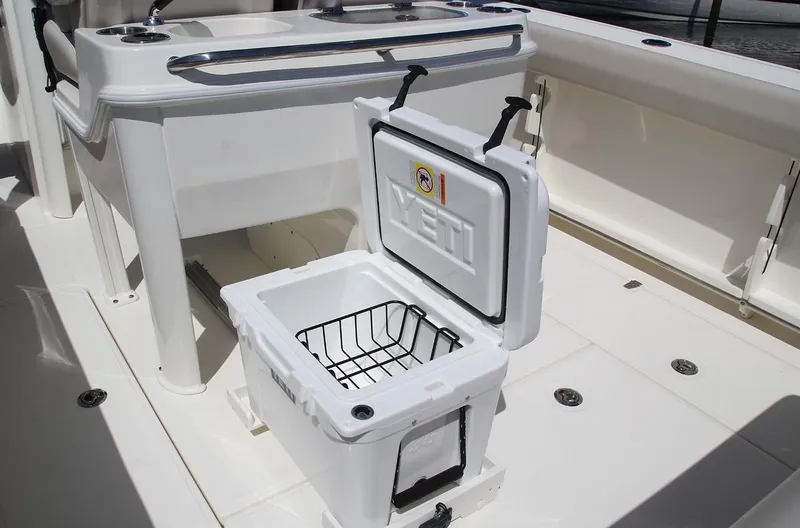 Slide: The Image of Manufacturer Provided Image: 2025 Boston Whaler 280 Outrage boat interior with open Yeti cooler. - 10