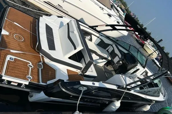 Slide: The Image of 2020 Monterey 278SS Super Sport boat docked, featuring sleek design and spacious seating. - 0