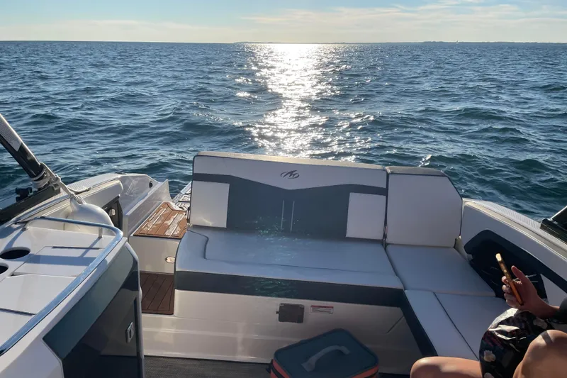 Slide: The Image of 2020 Monterey 278SS Super Sport boat on open water, sun reflecting on waves. - 11