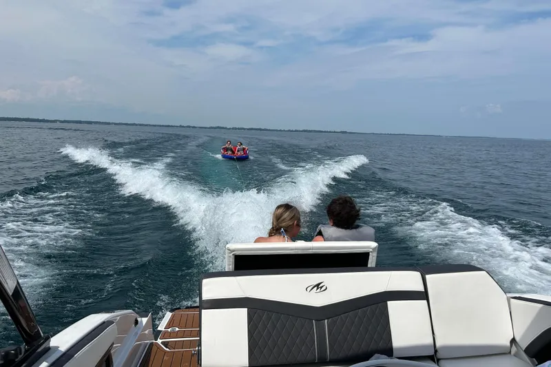 Slide: The Image of 2020 Monterey 278SS Super Sport towing tubers on a sunny lake day. - 12