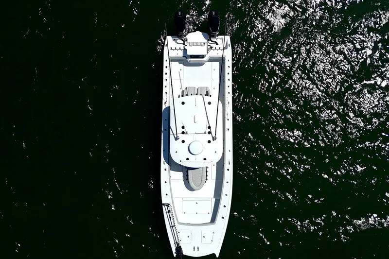 Slide: The Image of Aerial view of 2023 Freeman 34VH boat on shimmering water. - 11