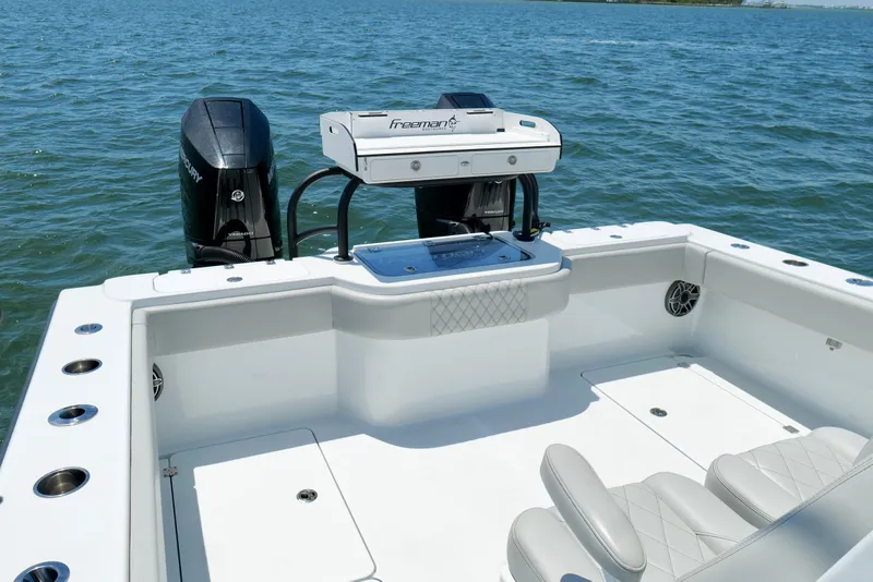 Slide: The Image of Freeman 34VH 2023 boat with dual Mercury engines on open water. - 12