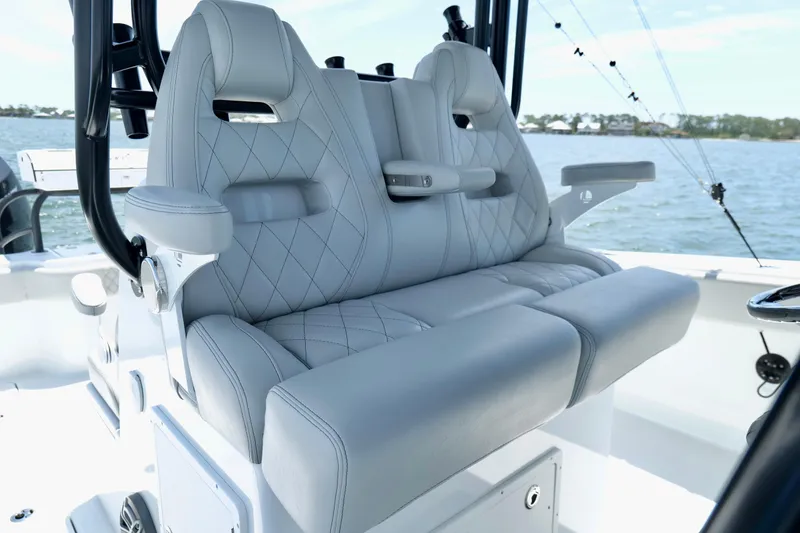 Slide: The Image of Luxurious seating on 2023 Freeman 34VH boat with diamond-stitched upholstery, ocean backdrop. - 20