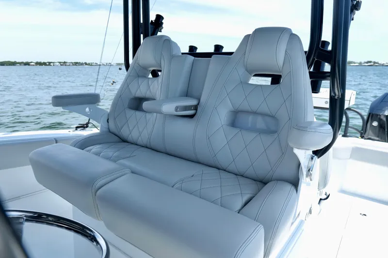 Slide: The Image of Luxurious seating on 2023 Freeman 34VH boat with diamond-stitched upholstery, ocean backdrop. - 21