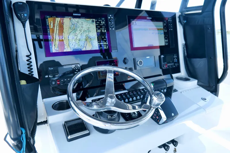 Slide: The Image of Helm of 2023 Freeman 34VH boat with advanced navigation displays and controls. - 22