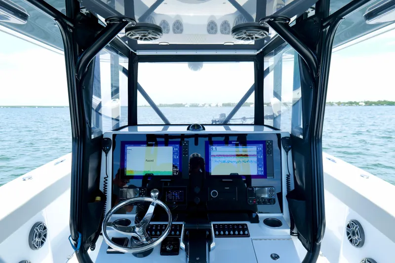 Slide: The Image of Interior view of 2023 Freeman 34VH boat cockpit with advanced navigation displays. - 23
