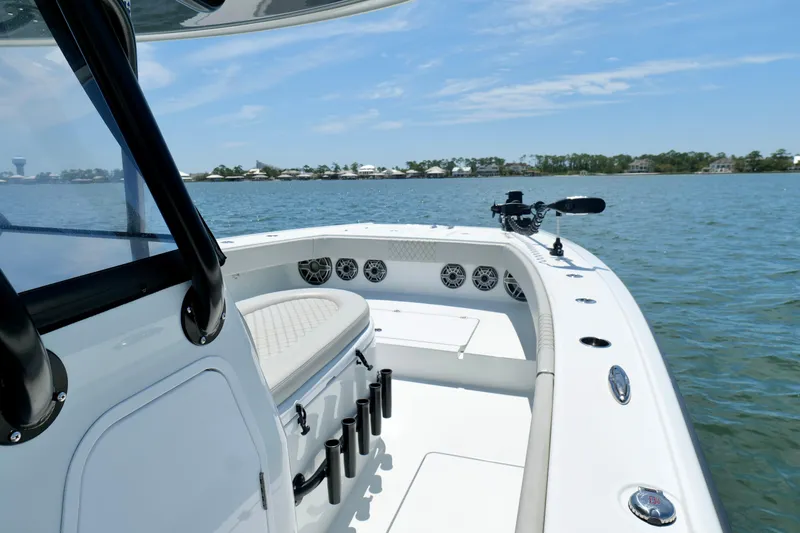 Slide: The Image of 2023 Freeman 34VH boat on water, showcasing sleek design and spacious deck. - 27