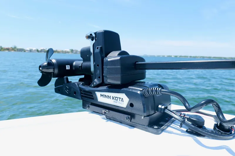 Slide: The Image of Minn Kota Instinct motor on Freeman 34VH boat, 2023, in sunny waterscape. - 29