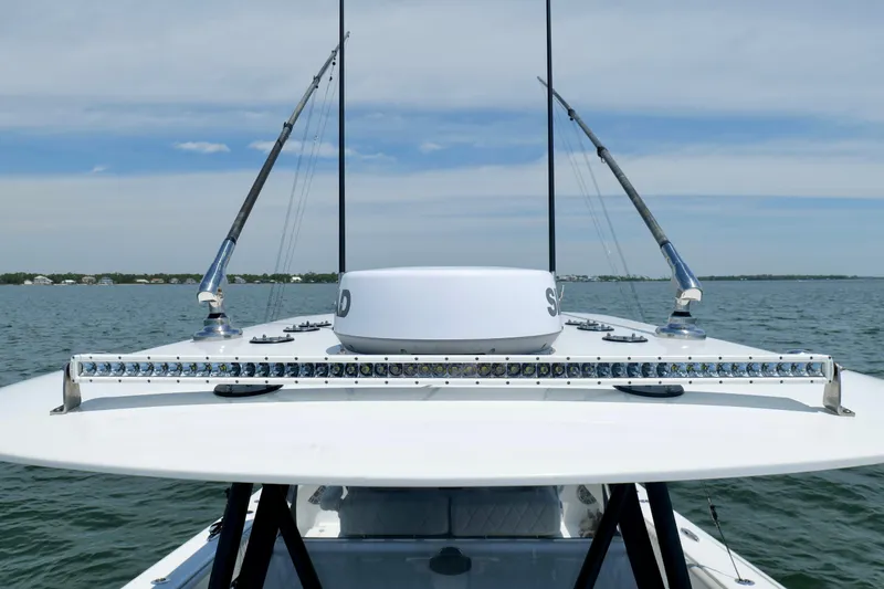 Slide: The Image of 2023 Freeman 34VH boat with fishing rods and radar on open water. - 33