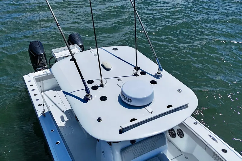 Slide: The Image of 2023 Freeman 34VH boat with dual engines on water. - 34