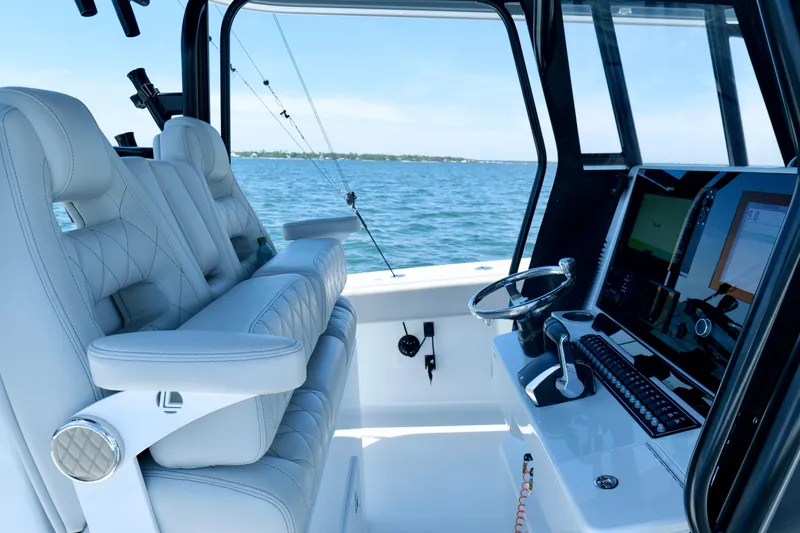 Slide: The Image of Luxurious interior of 2023 Freeman 34VH boat with modern helm and plush seating. - 4