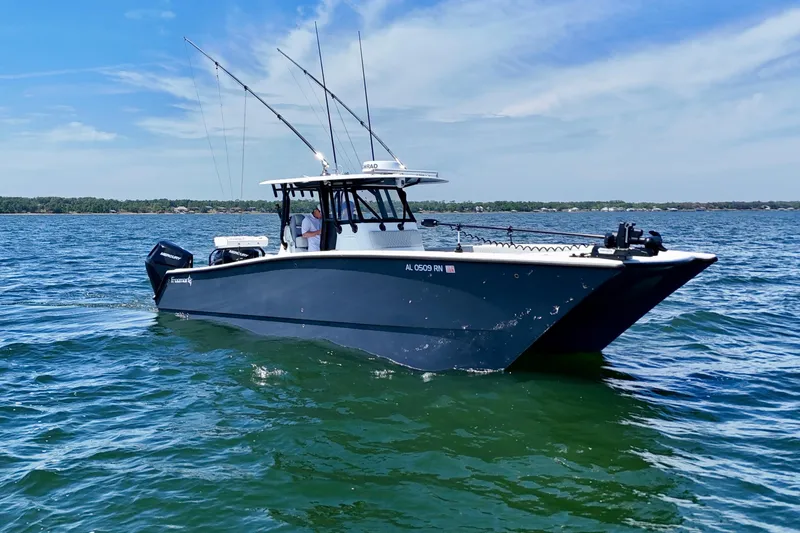 Slide: The Image of 2023 Freeman 34VH boat on open water under clear blue sky. - 5