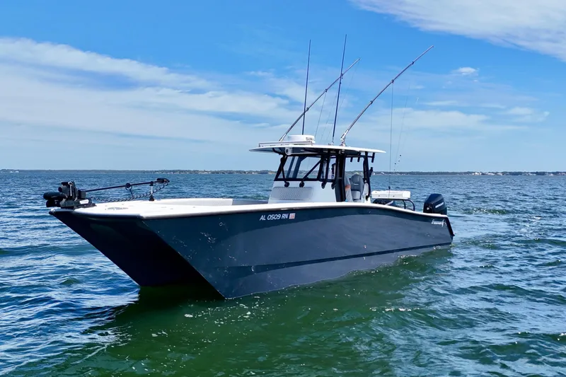 Slide: The Image of 2023 Freeman 34VH boat on open water under clear blue sky. - 6