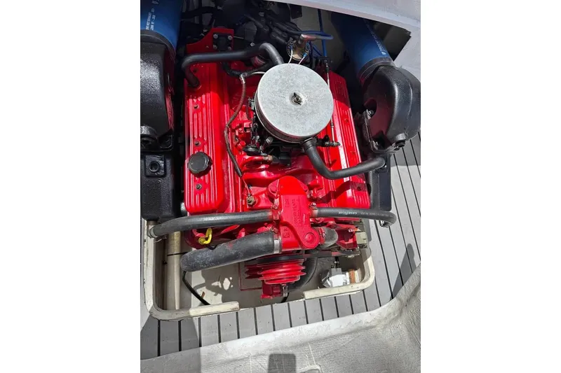 Slide: The Image of Engine of a 1968 Donzi 18 Classic boat, featuring a vibrant red color. - 3