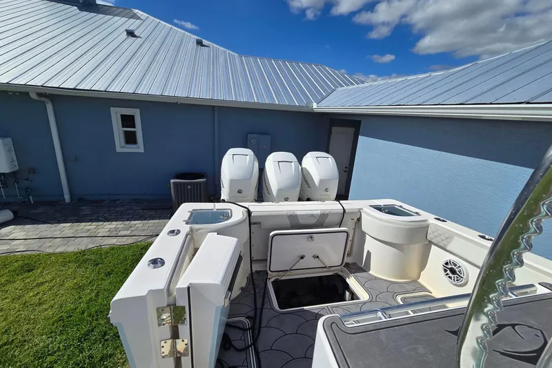 Slide: The Image of Aft cockpit showing dive door on starboard side. live wells in eash aft corner. Lazarette access to quad high capacity live well pump box - 7