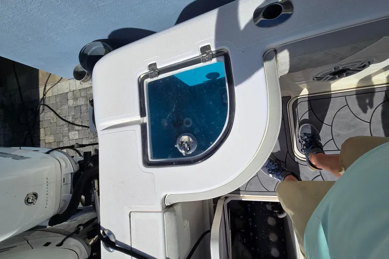 Slide: The Image of Overhead view of 2021 Streamline 35 CC boat deck with livewell and engine. - 9