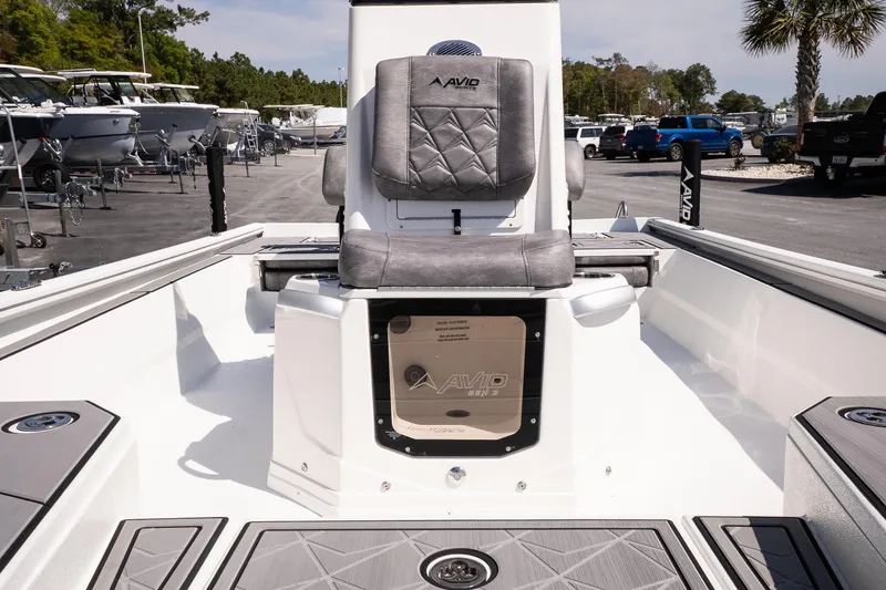 Slide: The Image of 2026 Avid 21 Mag boat interior with gray seating and modern design. - 19