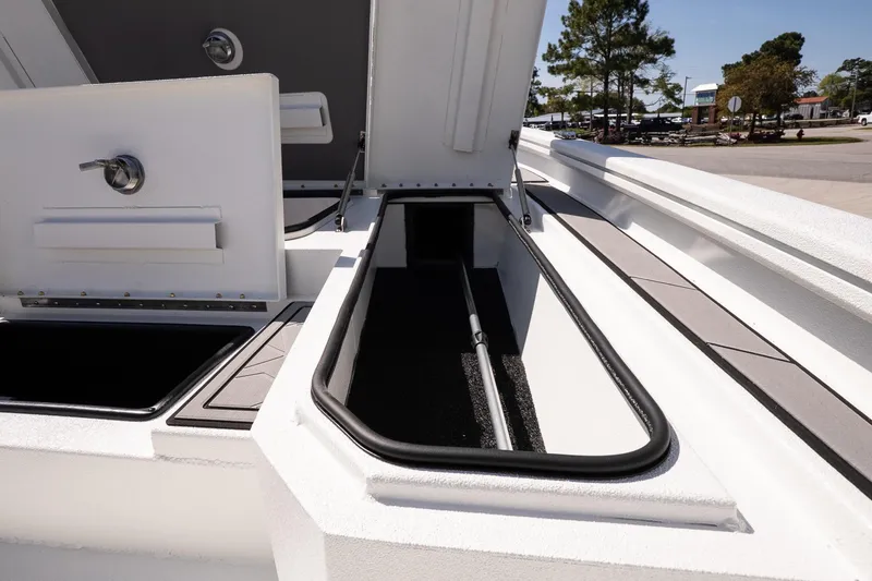 Slide: The Image of Open storage compartments on a 2026 Avid 21 Mag boat, showcasing interior design. - 21