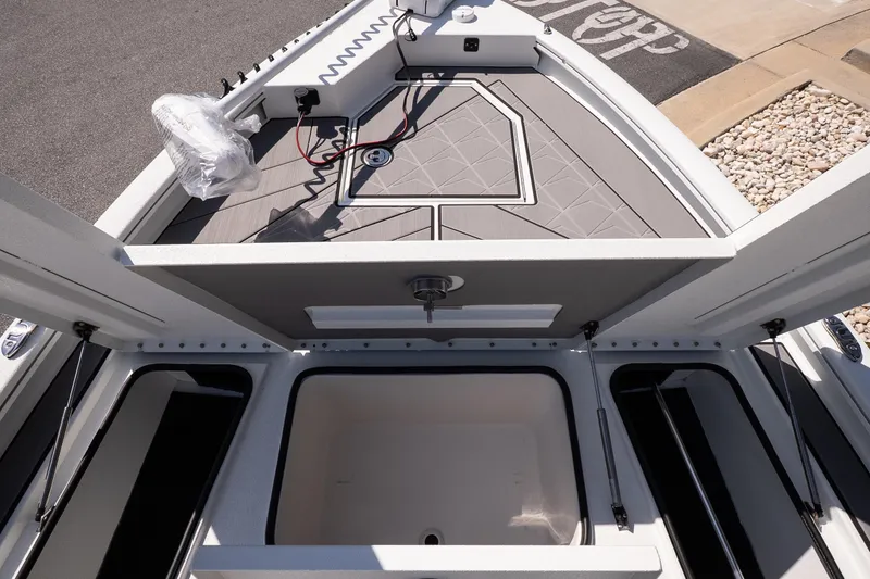 Slide: The Image of Avid 21 Mag 2026 boat interior with storage compartments and modern design. - 22