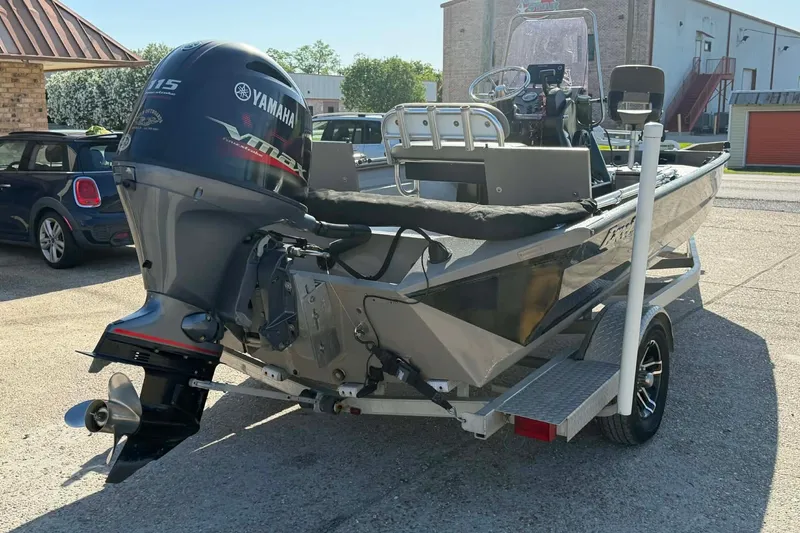 Slide: The Image of 2020 Excel 203 Bay Pro boat with Yamaha outboard motor on a trailer. - 11