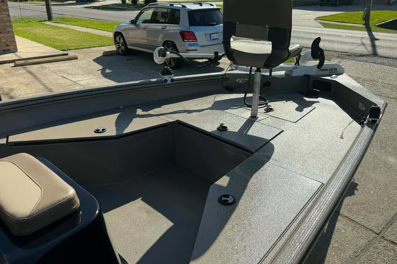 Slide: The Image of 2020 Excel 203 Bay Pro boat with seating and Minn Kota trolling motor. - 13