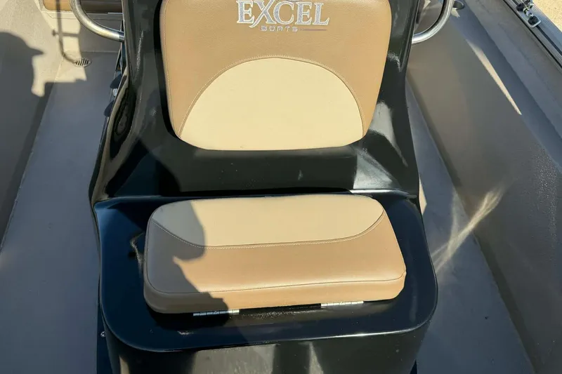 Slide: The Image of 2020 Excel 203 Bay Pro boat seat with tan and black design. - 14